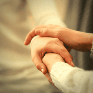 Holding hands when giving words of comfort for miscarriage