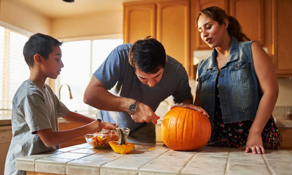 foster family carving pumpkin texas