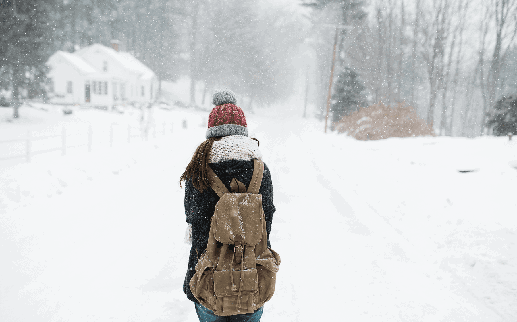 is your teen at risk - young woman walking down a snowy road with backpack