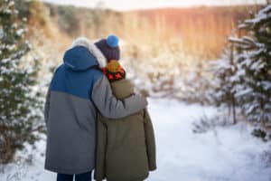 two children embracing at Christmas