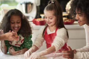 Children making cookies and enjoying the holidays in foster care