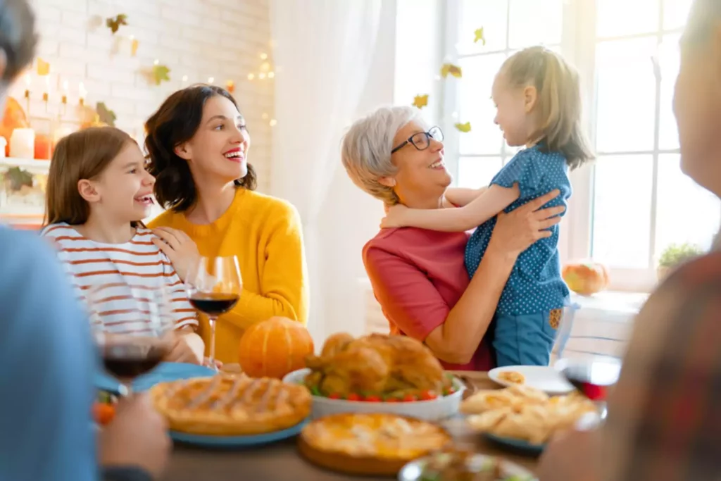 Thanksgiving gratitude. three generations gathered at the table for thanksgiving