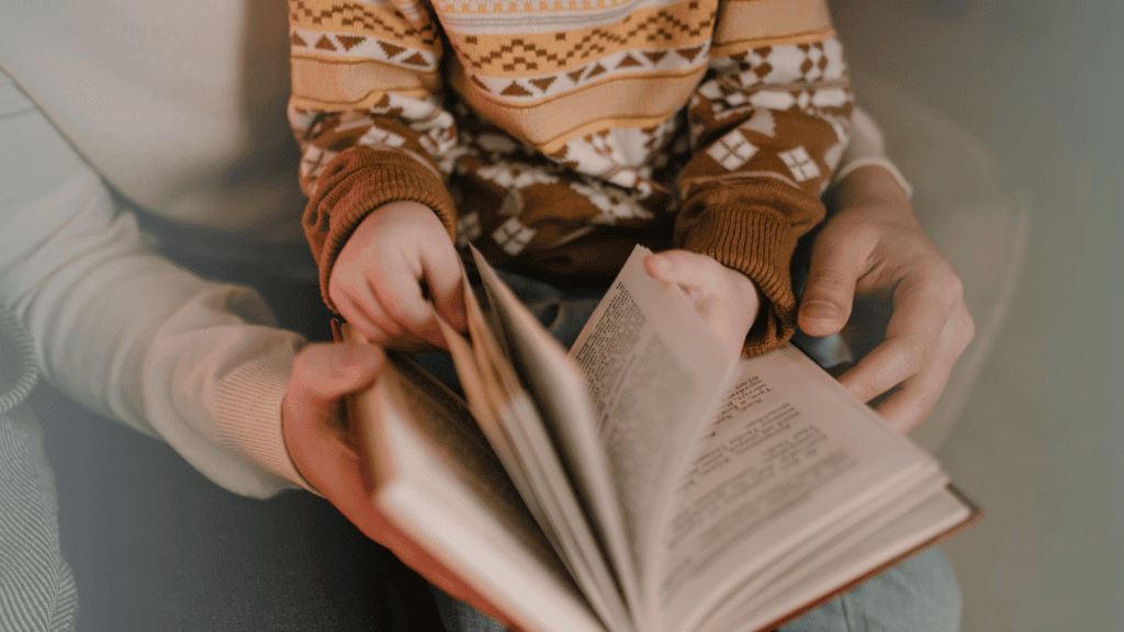 Christmas devotions with your child, young child sitting on her mother's lap as she reads a Christmas devotion