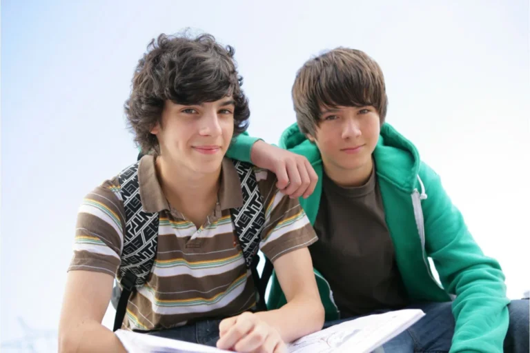 Two teen age boys smiling at the camera