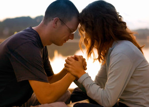 Married-young-couple-praying-together