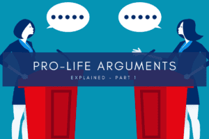 Two women stand debating pro-life arguments.