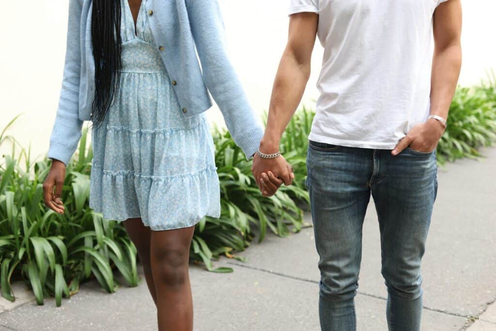 teen boy and girl holding hands