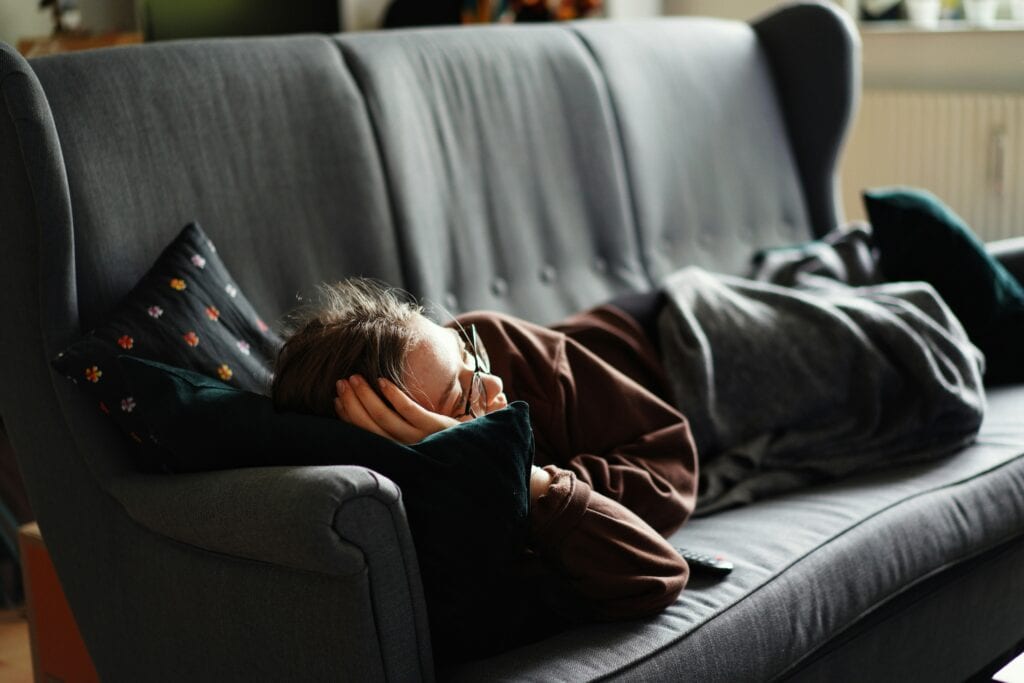 teen lying on the couch