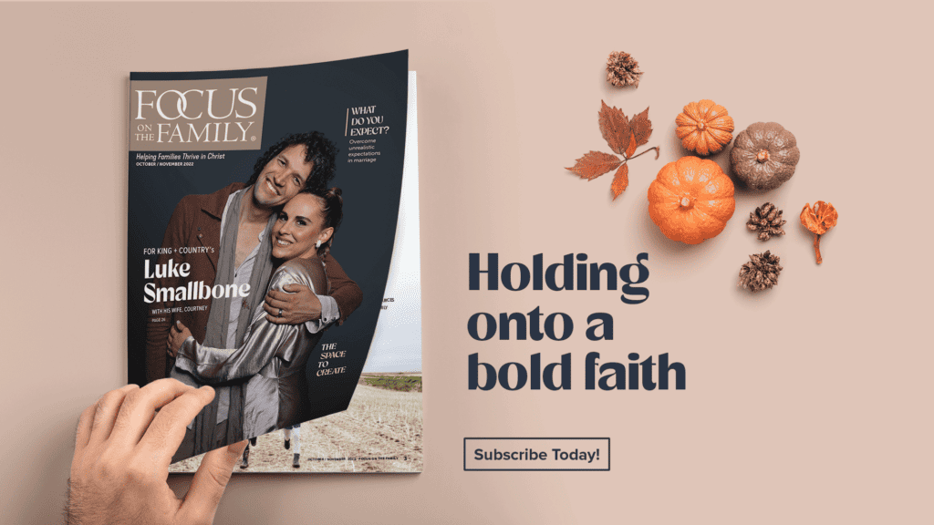 A hand opens the Oct/Nov issue of Focus on the Family magazine. "Holding onto a bold faith"