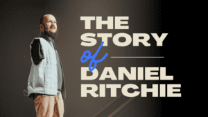 Image of a man Daniel Ritchie with no arms speaking about his story