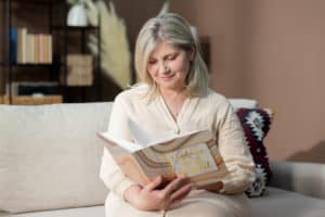 foster mom looking at photos after foster child leaves