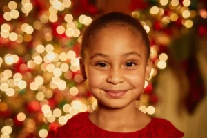 Christmas gift giving can make a child smile like this little girl