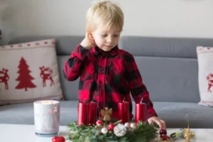 Little boy looking at an Advent Wreath. Why is Advent so important?