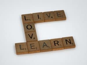 Scrabble words that say live, love and learn talking how perfect love casts out fear