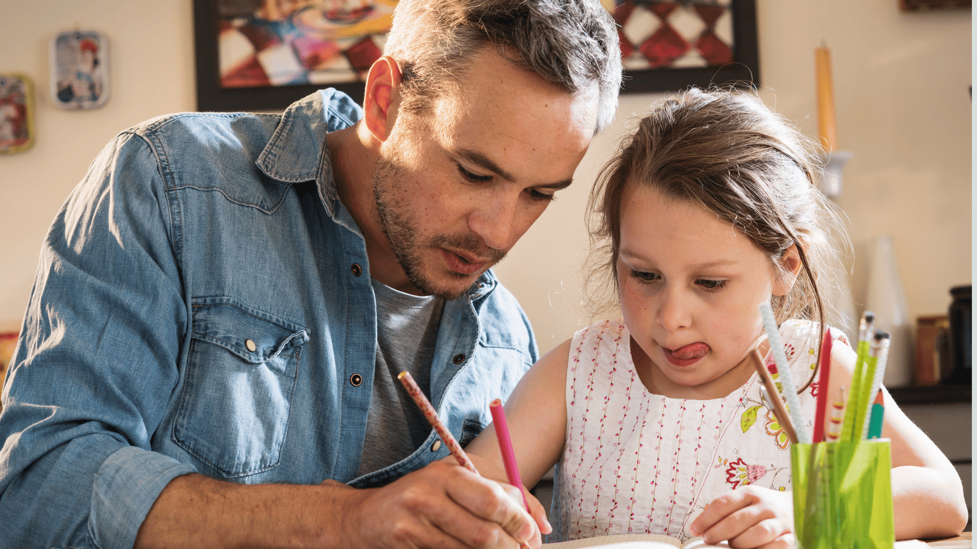 Should I homeschool? Father and daughter working on her education as a homeschooling family