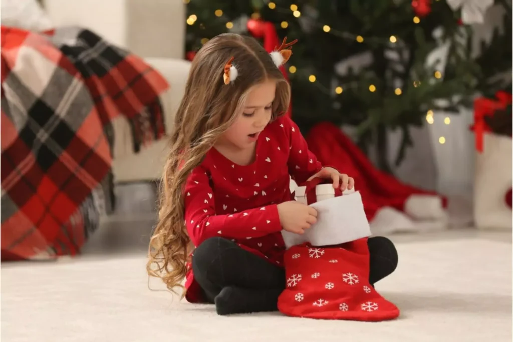 A child opening a stocking is one of many holiday traditions