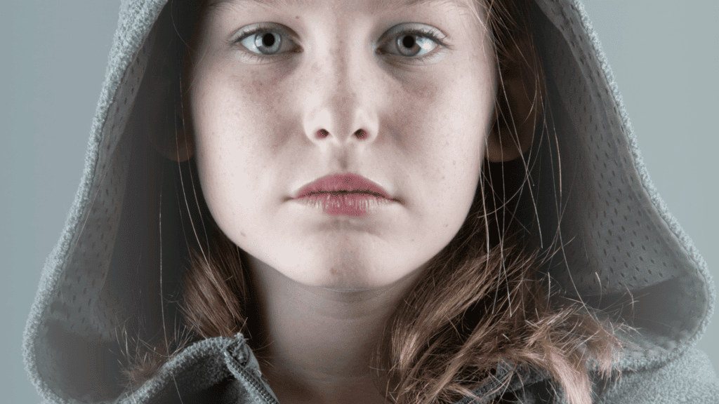 Emotional wounds in teens can create defiance, young girl with an emotional wound