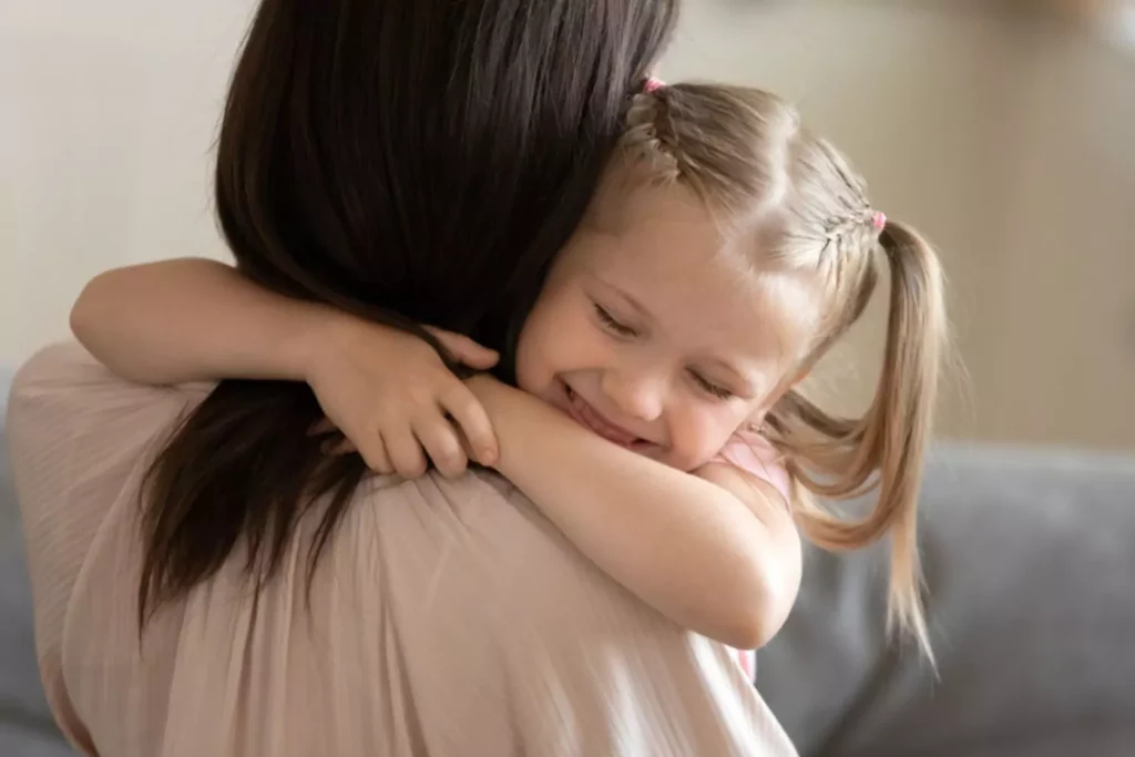 grateful child hugging her mom