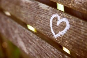 Chalk heart drawn on a bench and other ways to inspire love from Bible Verses for Valentine's Day