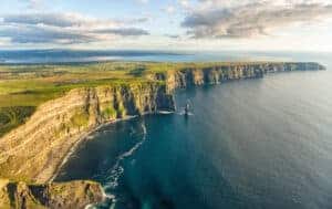 Arial birds eye drone view from the world famous cliffs of moher in county clare ireland. Scenic Irish rural countryside nature along the wild atlantic way.