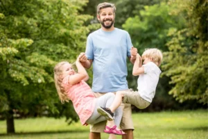 Father with two children playing and loving a teachable moment