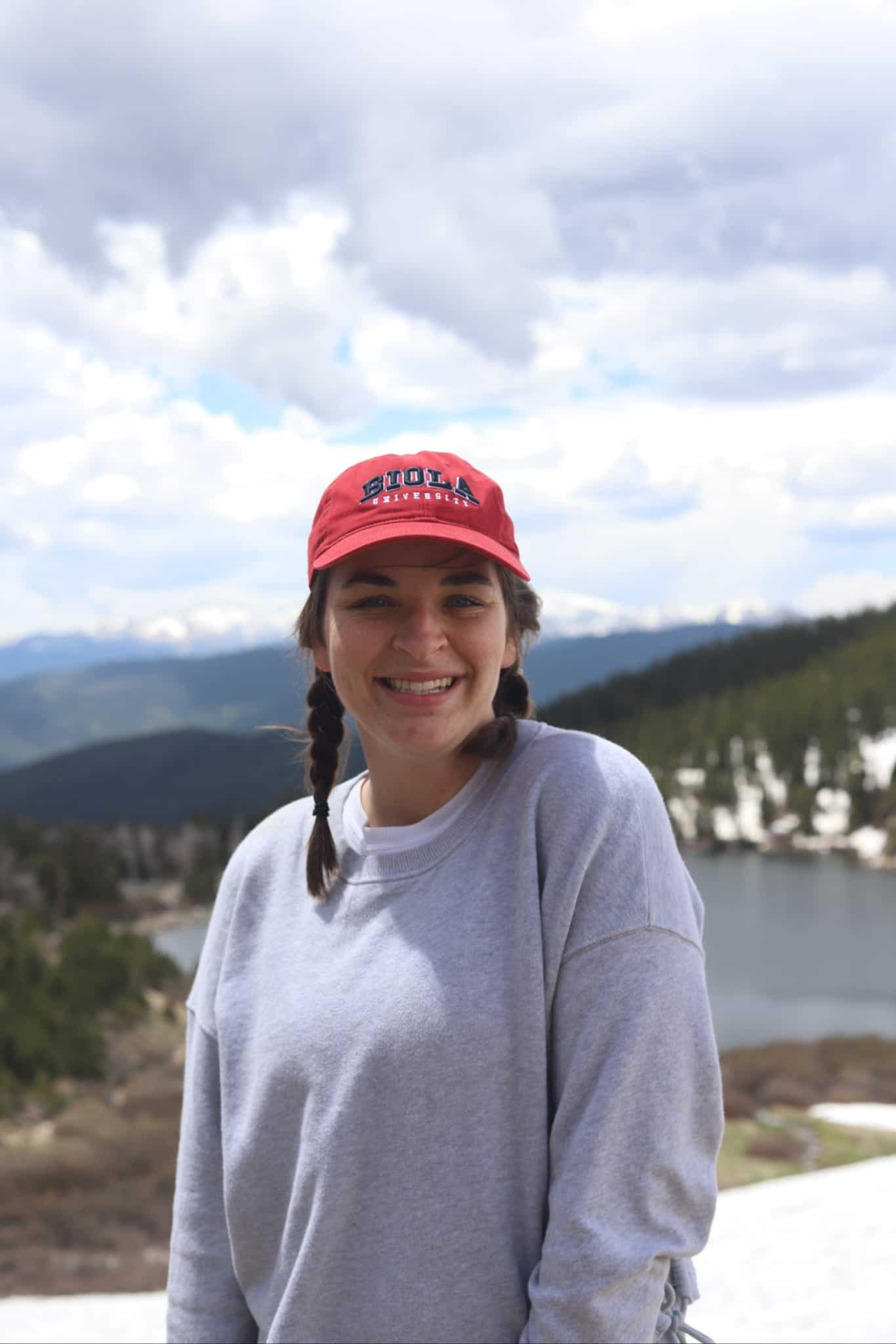 intern in front of lake