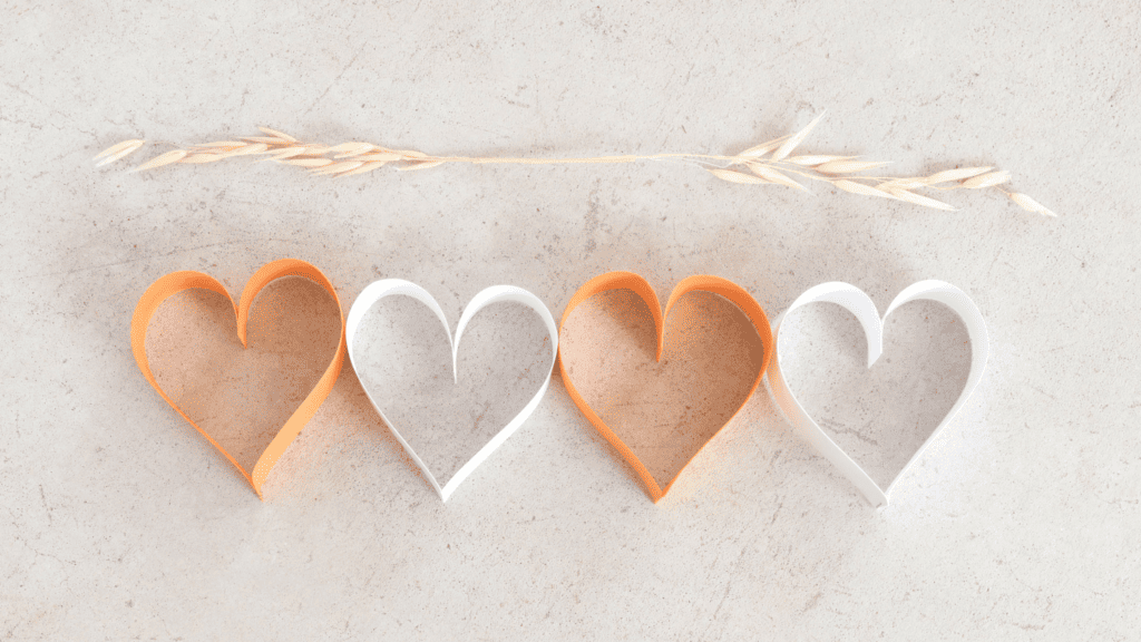Textured background with wheat and paper hearts overlaid