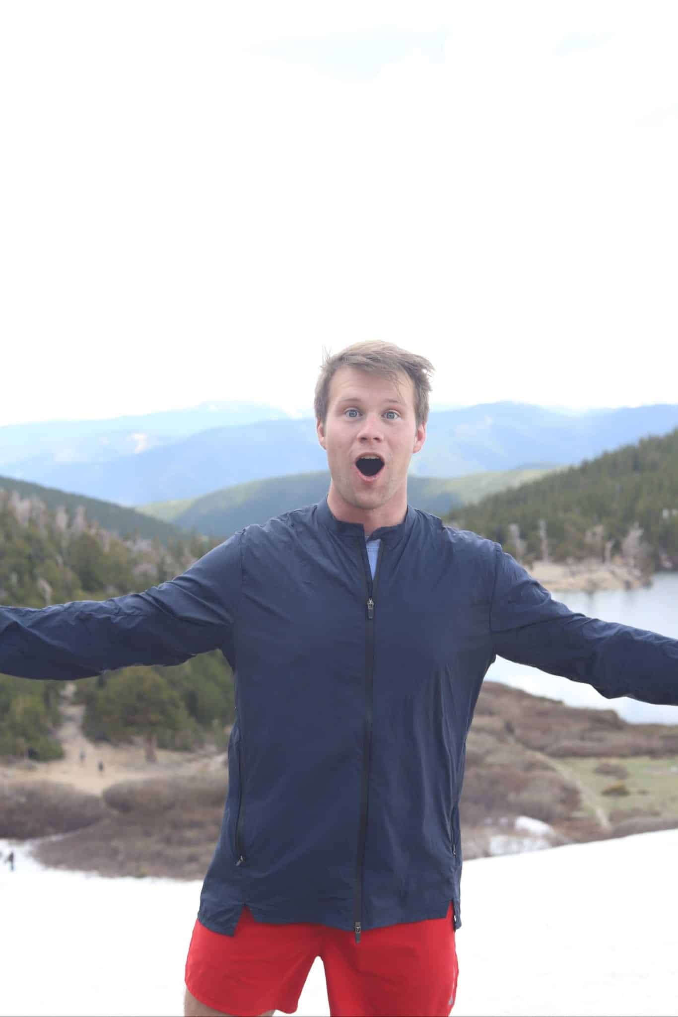 intern standing in snow on mountain