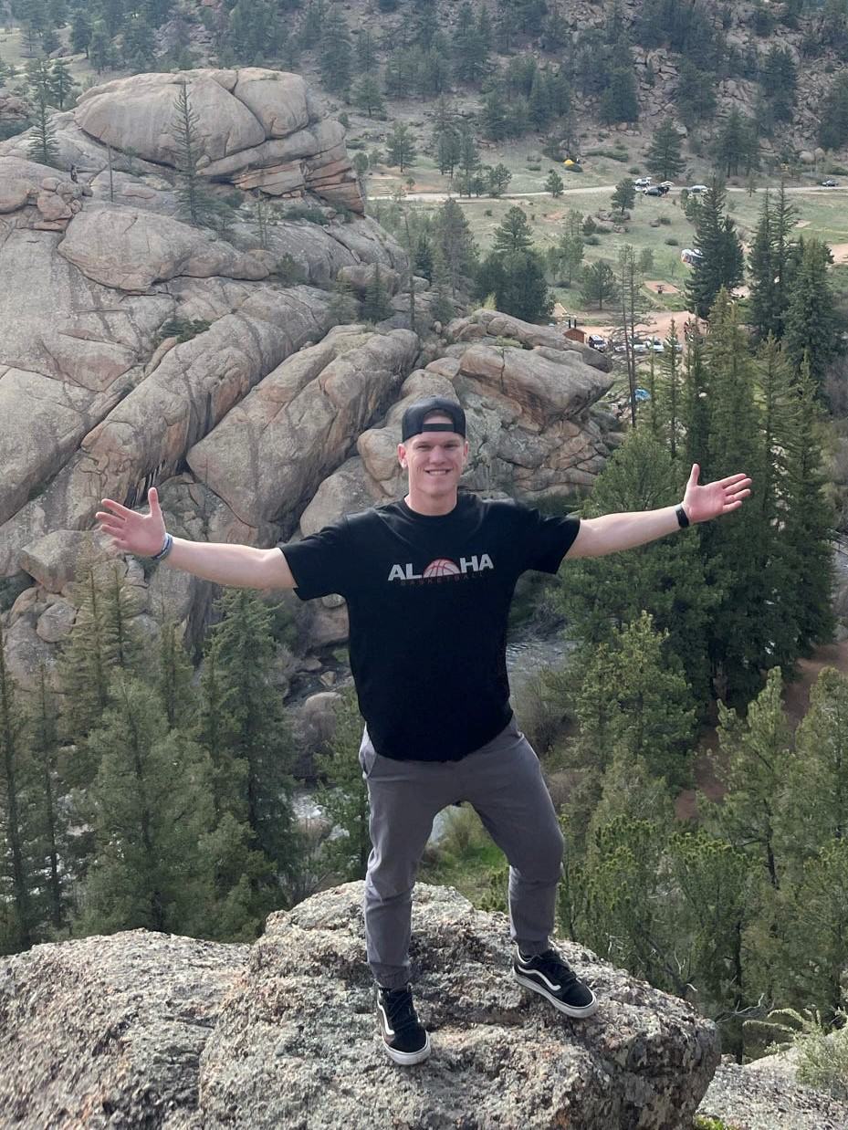 intern standing on mountain