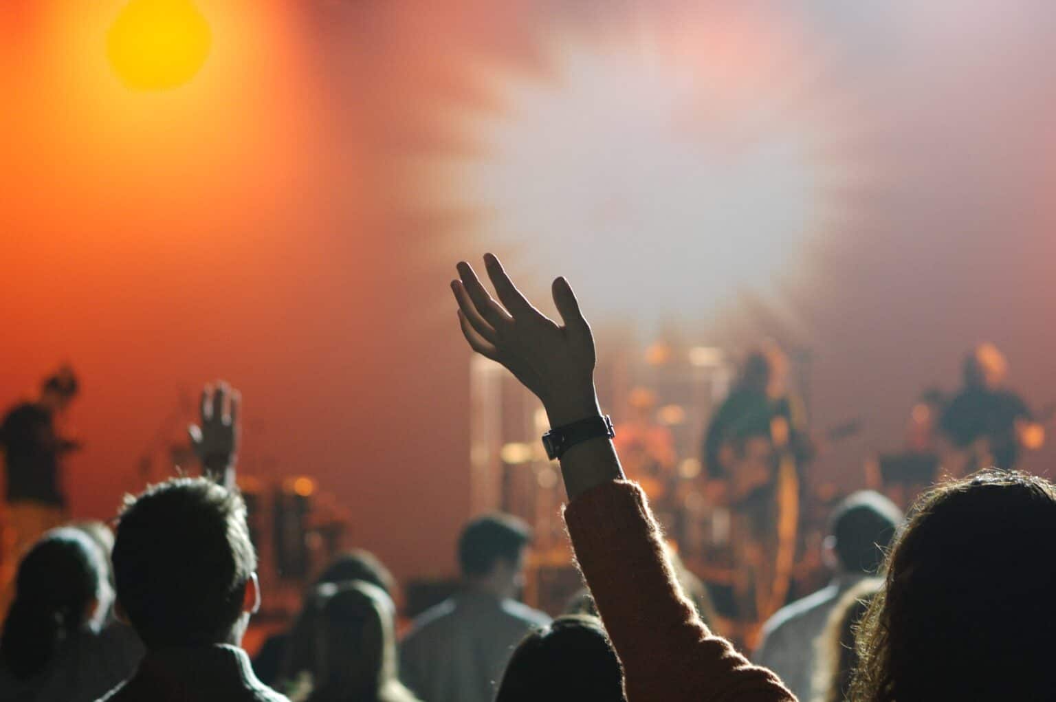 humility worshippers with hands raised