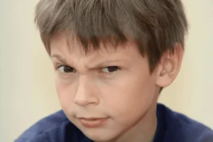 School-aged boy with a quizzical expression