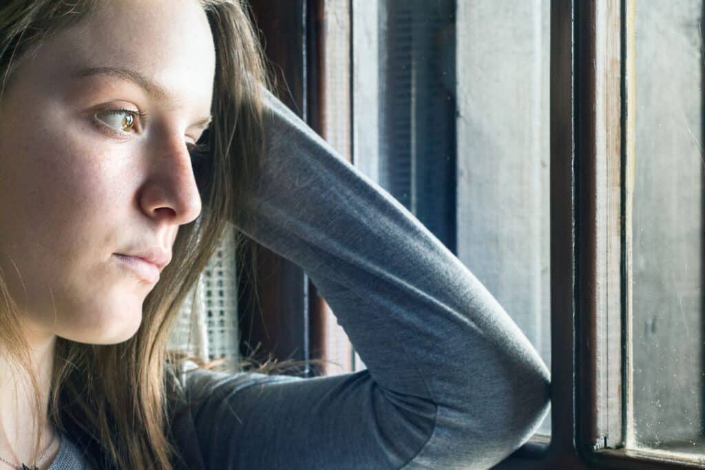 Reading teen's body language, is tricky like this young woman staring out of the window.