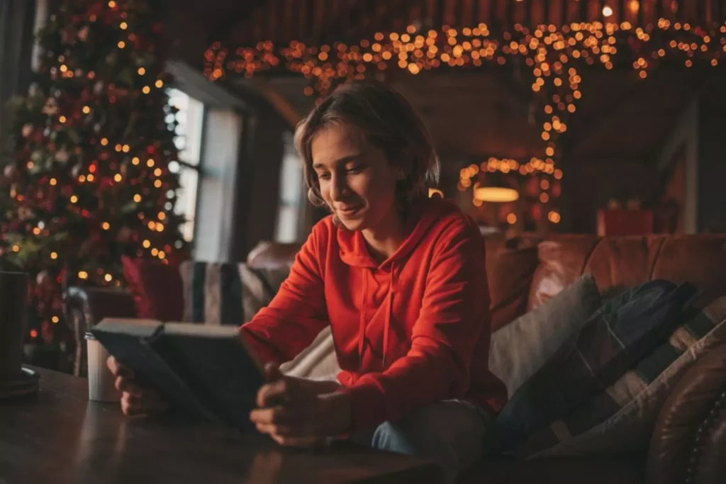 Young man reading bible verses on Christmas