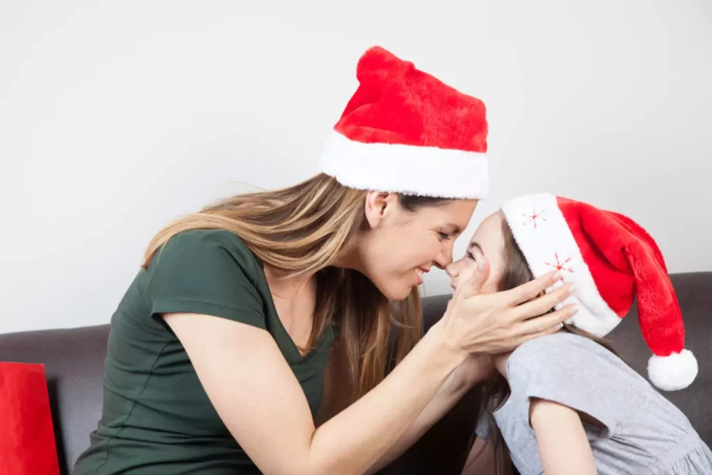 tween girl and her mother nose to nose