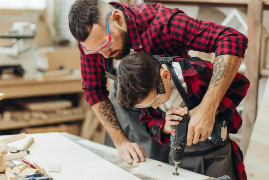 Father and son working with wood together