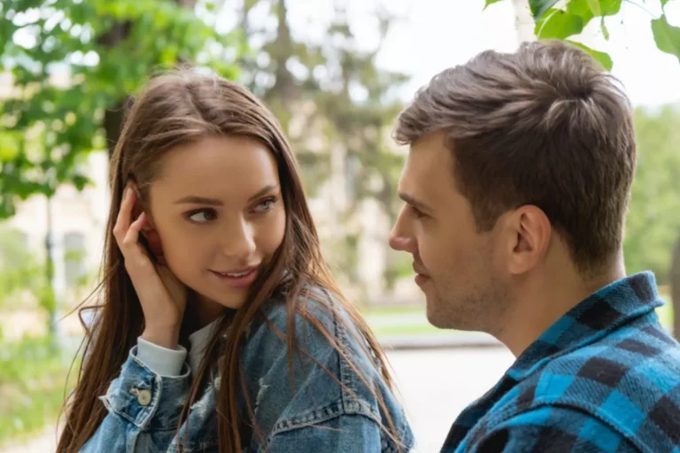 A young couple gazes into each other’s eyes with warmth and affection, symbolizing the importance of sexual integrity in relationships.