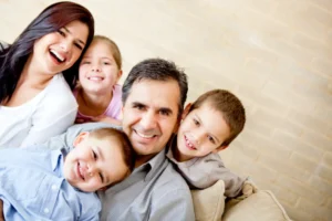 Happy family of five portrait. Two little boys and one little girl with their mom and dad