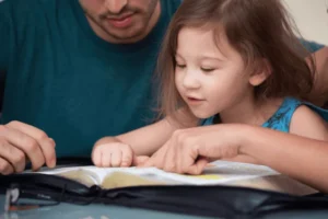A parent teaching his child about resilience through stories in the bible