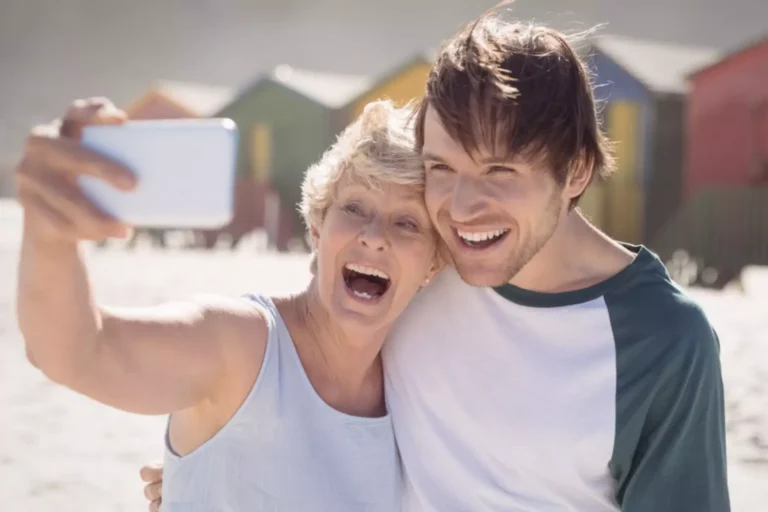 supporting your son's marrage. Mother and adult son taking a selfie together.