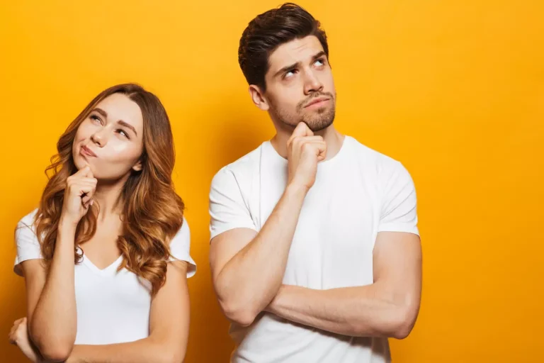 A woman and man stand next to each other contemplating the difference between each other. God Designed men and women to be different in marriage. Here's how to honor those differences.