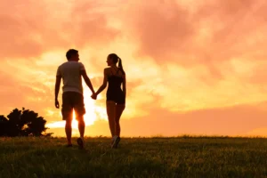 A male and female couple walk hand-in-hand into an orange sunset. Soul mates are not mentioned in the Bible, but the bible offers all kinds of advice on how to build a lasting relationship with your spouse.