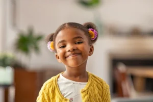 Sweet little girl with a big smile -raising a child of the king