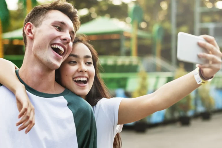 Young teen couple taking a selfie.