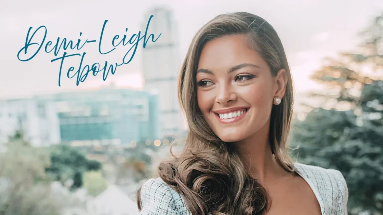 Photo of Demi-Leigh Tebow standing on balcony in city.