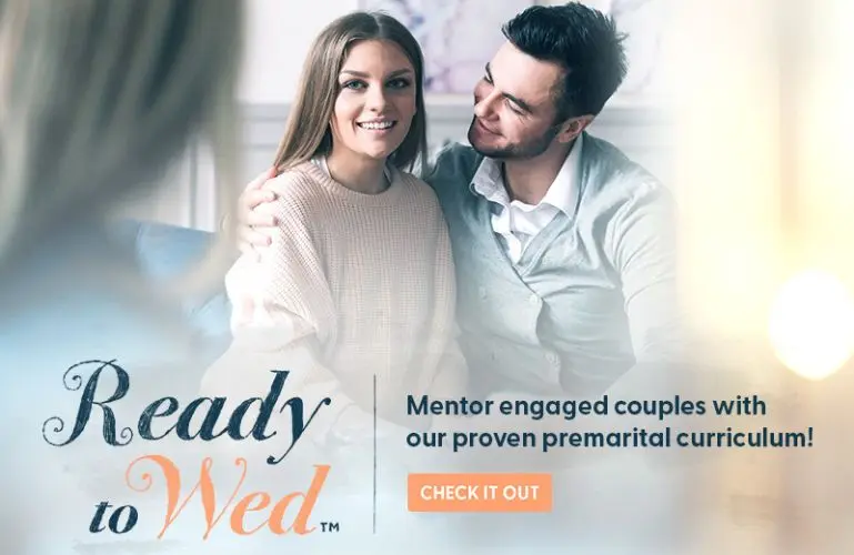 Engaged couple sitting together during premarital mentoring session for Ready to Wed curriculum