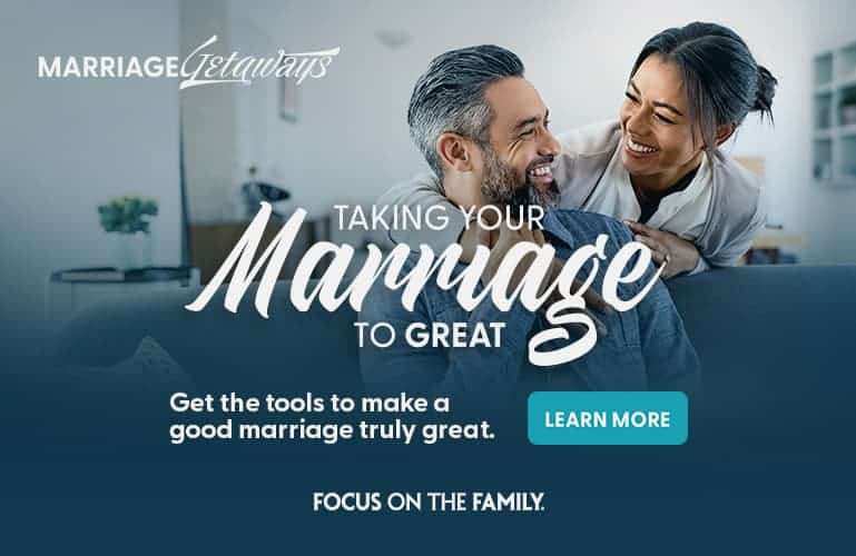 Couple laughing and embracing at home - Marriage Getaways Taking Your Marriage to Great