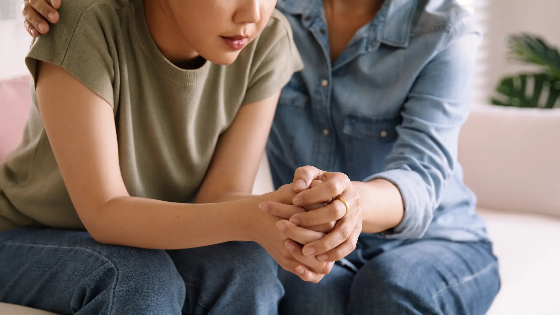 A woman comforting a friend during an emotional moment, offering support and empathy
