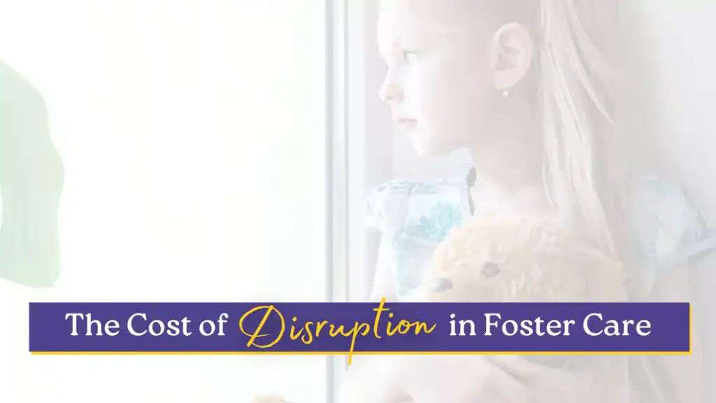 Young girl staring out a window, symbolizing the emotional impact of disruption in foster care.