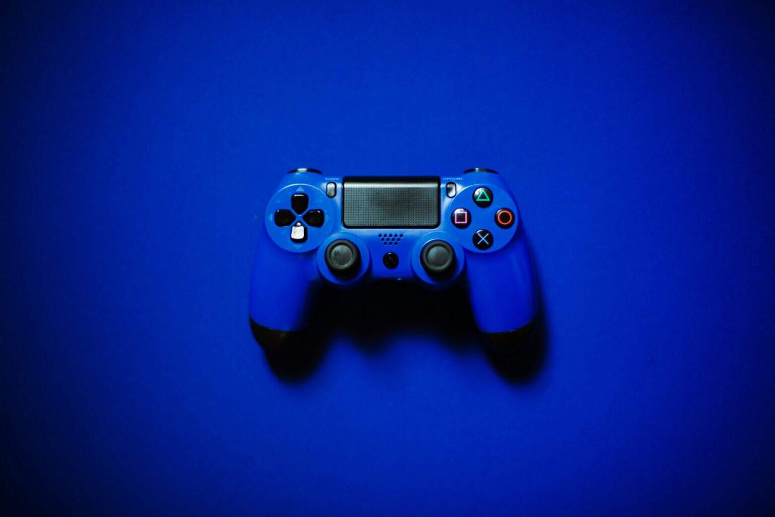 This image shows a blue controller in front of a blue background, set to describe the idea of video games. What does the bible say about video games?