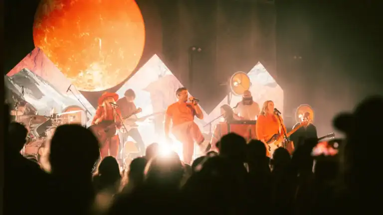 Photo of CAIN on stage during concert.